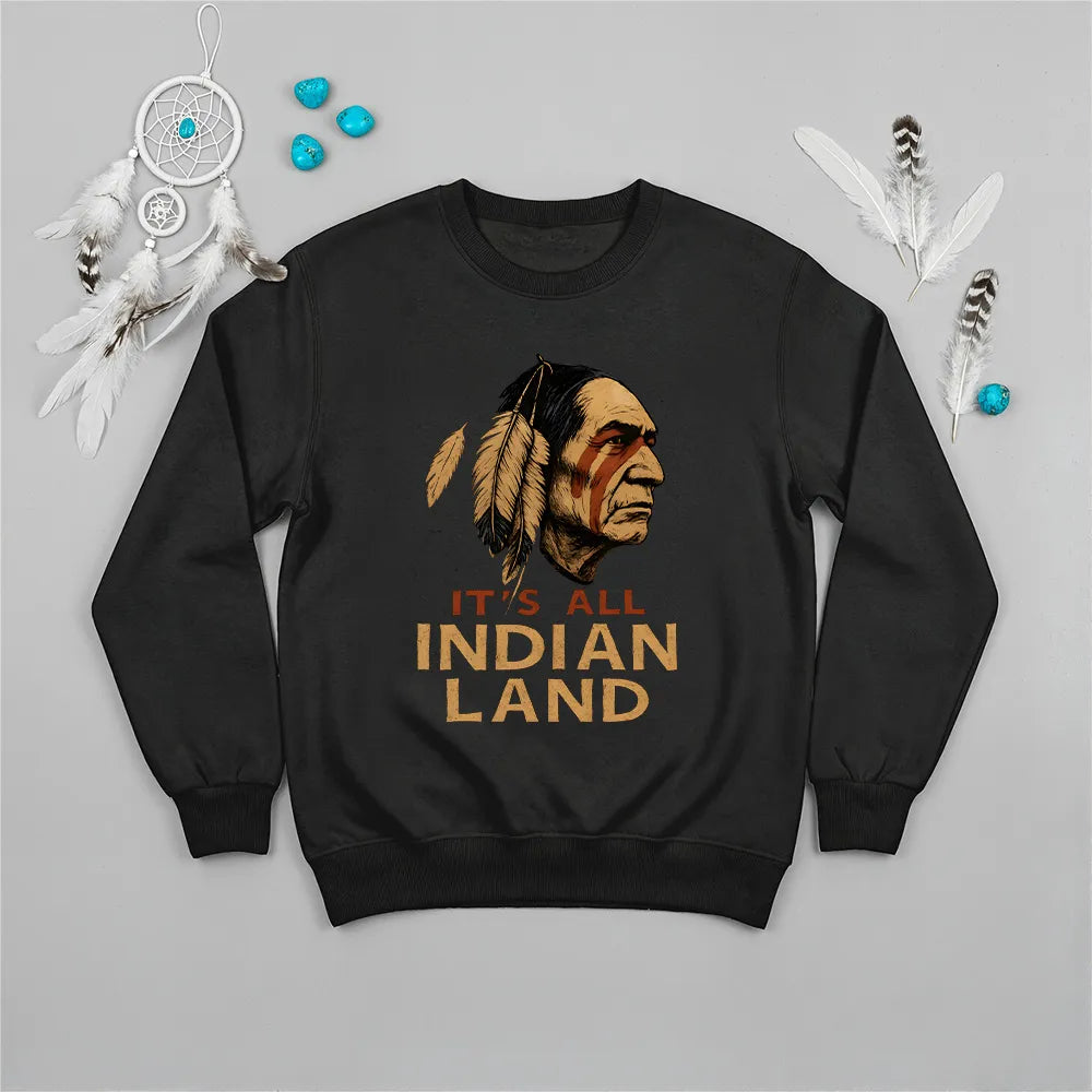  black sweatshirt featuring a Native American headdress design with the bold "It’s All Indian Land" slogan.