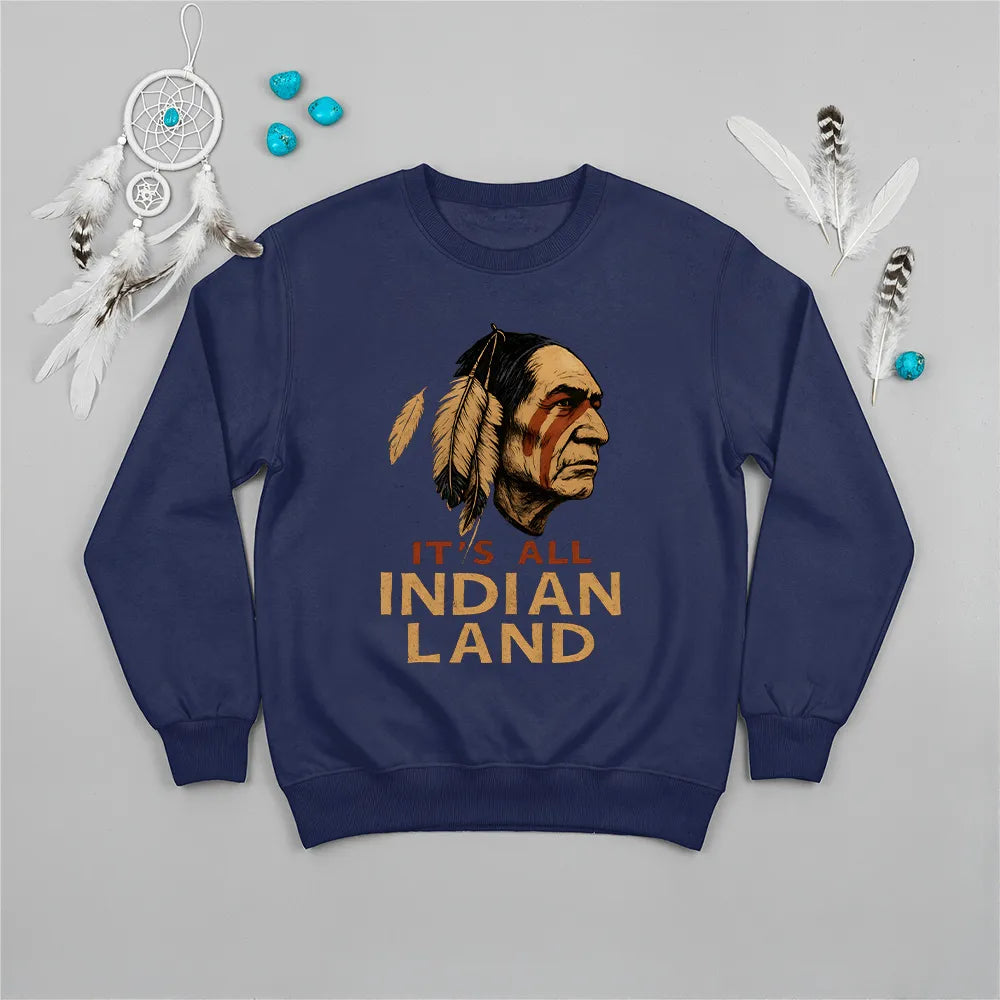 A navy blue sweatshirt with the "It’s All Indian Land" text and a traditional Native American headdress motif.