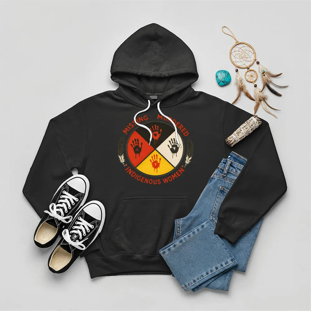 A black hoodie with a "Missing & Murdered Indigenous Women" graphic featuring a red handprint over feathers and text.