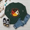 A forest green long-sleeve t-shirt showcasing the MMIW awareness design with the red handprint and feathers.