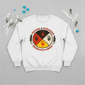 A white sweatshirt displaying the MMIW awareness graphic with a red handprint, feathers, and text, laid flat.