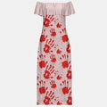 Side view of an off-shoulder maxi dress with red handprint motif cascading across the skirt.