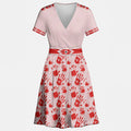 Front view of a pink V-neck dress with waist tie and scattered red handprint pattern.