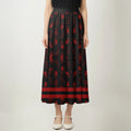 Maxi skirt featuring red handprints and symbolic Native design calling for justice for Indigenous women