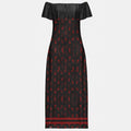 Off-shoulder dress with red handprints and powerful MMIW theme in Native style