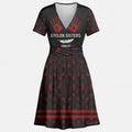 V-neck black and red dress with No More Stolen Sisters message and handprint pattern inspired by Native American culture