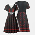 Wrap style dress with red handprints and MMIW message symbolizing solidarity with Native women