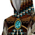 Close-up of Native American beadwork on snug sherpa hoodie showing detailed turquoise stones, arrow design, and woven bead patterns