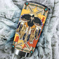 Close-up detail of Native American eagle dreamcatcher design on stainless steel tumbler showing feathers and beadwork