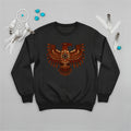 A black crewneck sweatshirt with a vibrant Native American Thunderbird graphic, displayed with indigenous-inspired accessories.