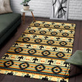 Native American inspired rug with vibrant tribal patterns in earthy tones, displayed in living room setting