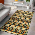 Modern interior space showcasing a rectangular Thunderbird-patterned rug with repeating rows of stylized thunderbird icons and diamond star motifs in warm earth tones.