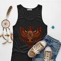 A black tank top with a vibrant Native American Thunderbird graphic, laid flat with a pair of jeans.