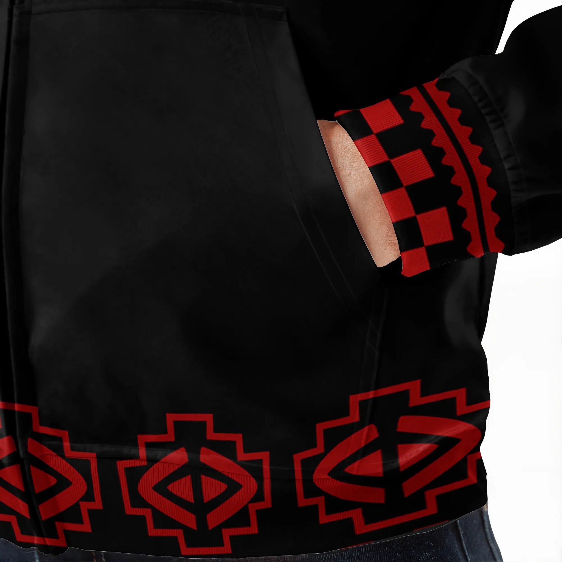 lose-up of fleece jacket cuff with red geometric tribal patterns and detailed stitching