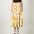 Front view of sunburst-patterned skirt with Native American-inspired waistband design, featuring vibrant yellow and pink floral motifs.