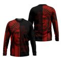 Black crewneck long sleeve Tshirt featuring red geometric patterns on sleeves and hem; back displays a powerful warrior portrait with the phrase “No One Is Illegal on Stolen Land” in bold red typography.