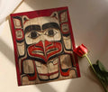 Close-up side view of Pacific Native American totem canvas art showing textured wooden slats and vibrant tribal colors