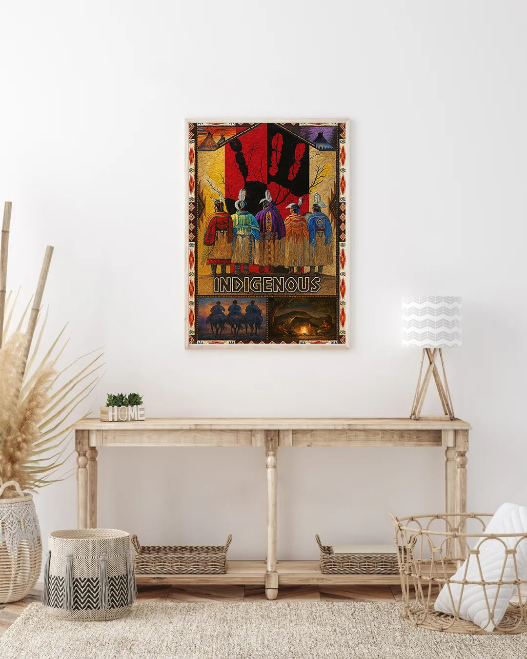 “INDIGENOUS” canvas print displayed above a wooden console, showcasing horse riders at sunset and campfire scenes within a tribal border.