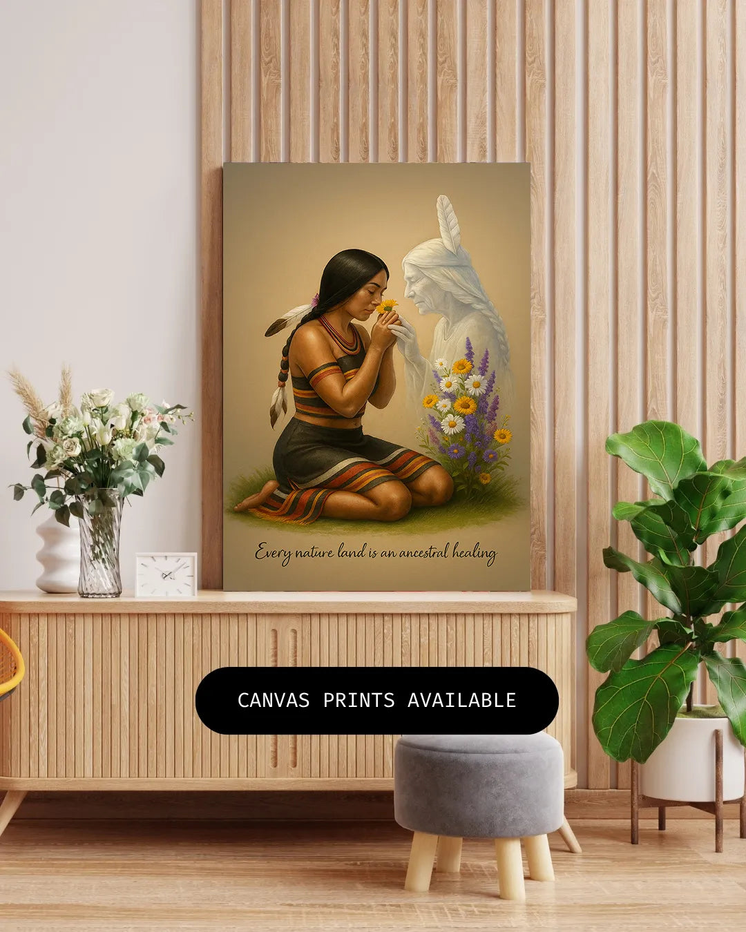 The art print styled on a wooden surrounded by a vase of dried flowers and a potted plant, emphasizing its warm tribal color palette.