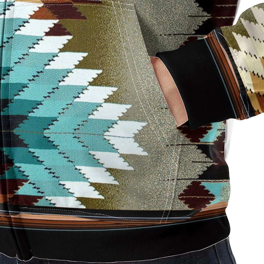Close-up of the fleece jacket’s kangaroo pocket, highlighting the large turquoise and cream diamond graphic on an olive backdrop, with black cuff and hem trim visible.