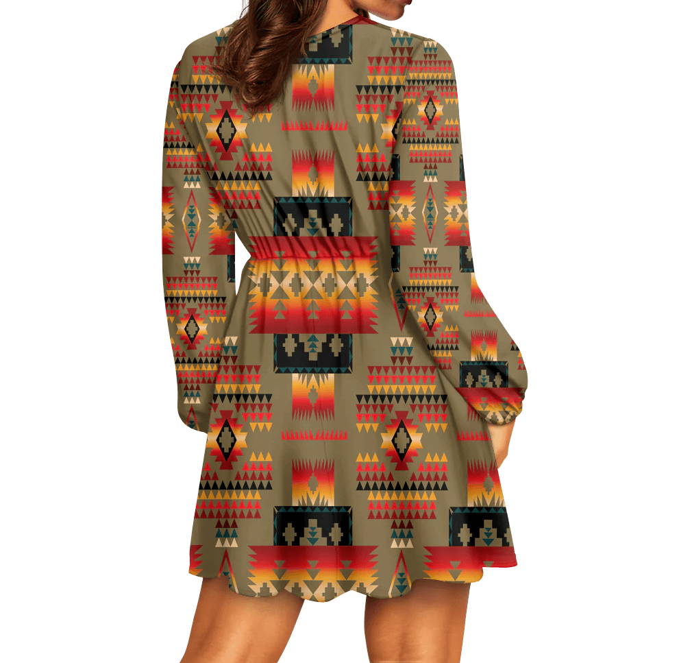 Back view of long sleeve mini dress with geometric tribal print and subtle cinched waist