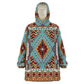 Front view of snug hoodie featuring turquoise and red Southwestern tribal geometric pattern with hood