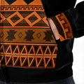Close-up of bold tribal patterns and orange stitching on Native American heritage hoodie