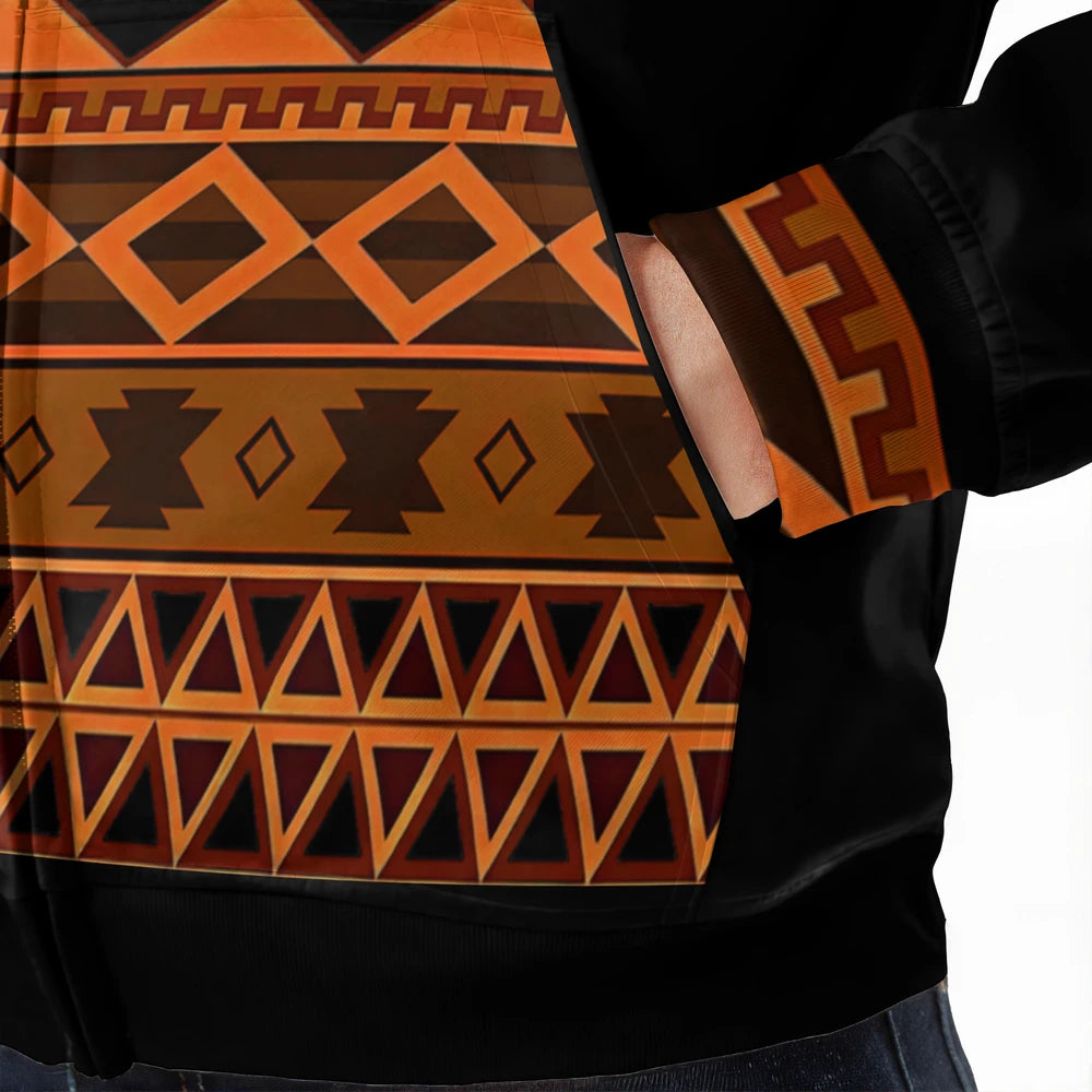Close-up of bold tribal patterns and orange stitching on Native American heritage hoodie