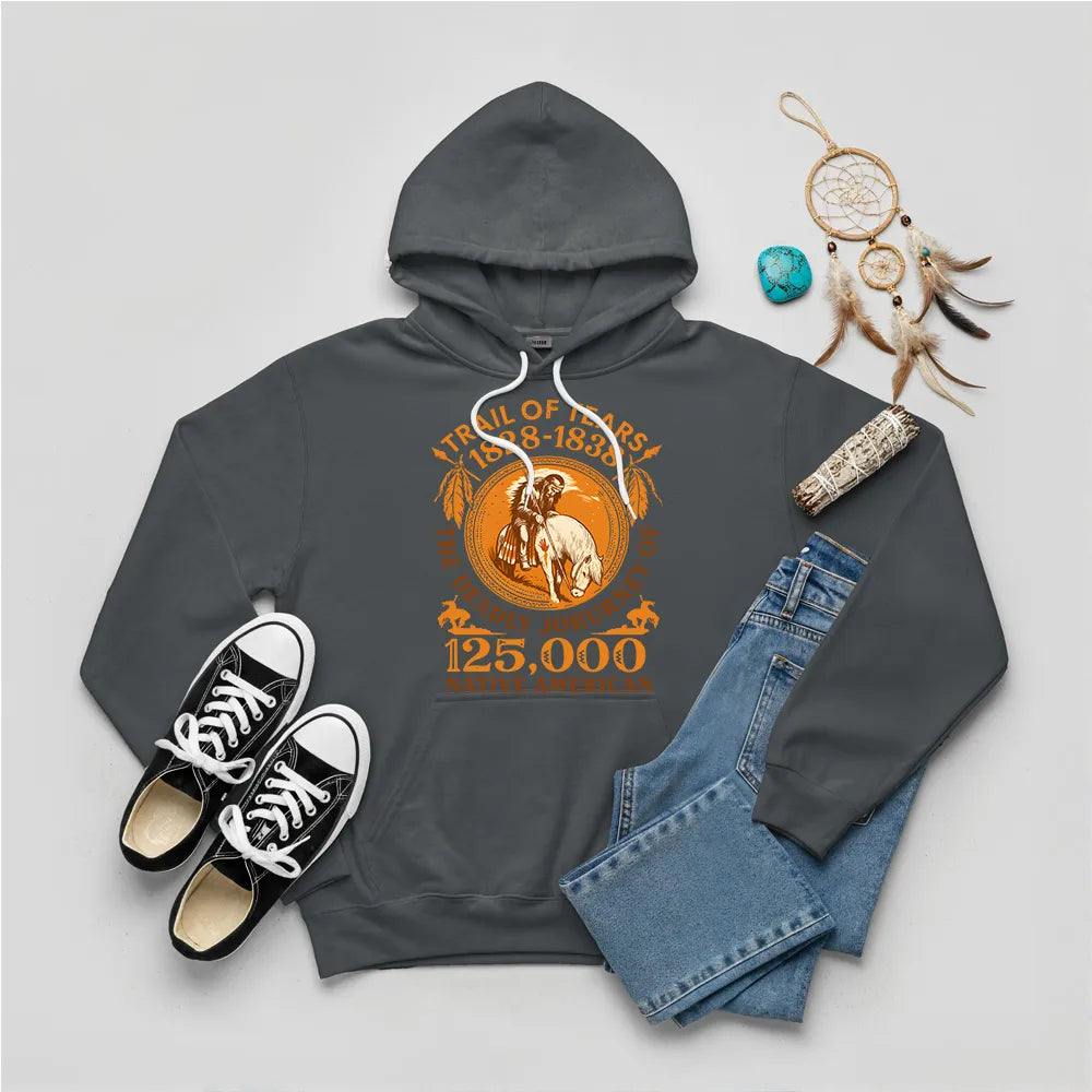 A dark grey hoodie with the "Trail of Tears" historical graphic, accompanied by a dreamcatcher and sage bundle.