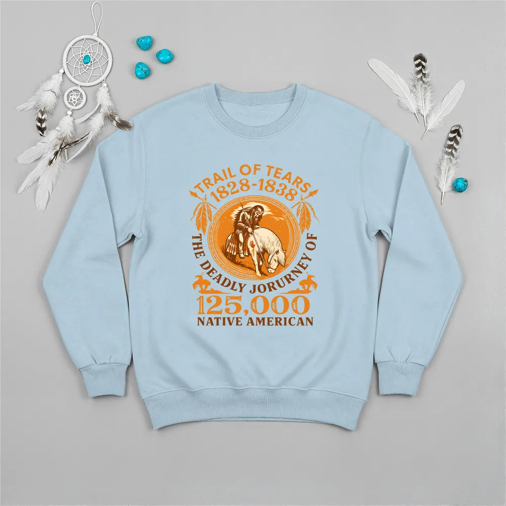 A light blue sweatshirt featuring the "Trail of Tears" commemorative design, styled with jeans and sneakers.