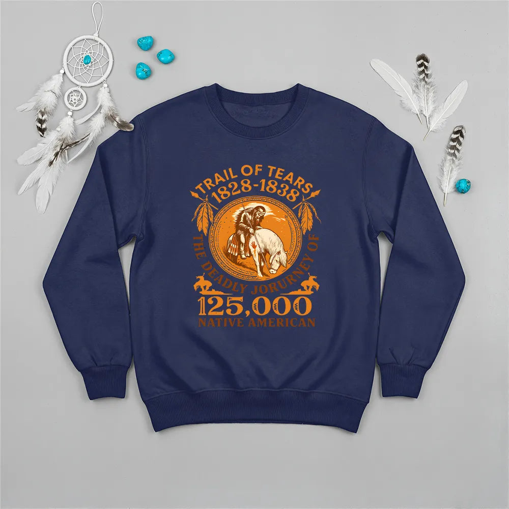 A navy blue sweatshirt displaying the "Trail of Tears" historical graphic, accompanied by a Native American-inspired accessory.