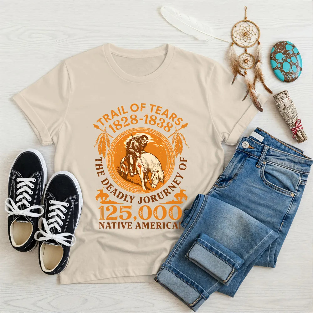 A beige t-shirt featuring the "Trail of Tears" commemorative design, displayed with traditional Native American symbols.
