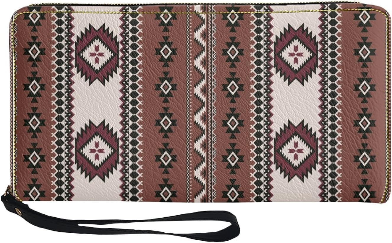 Front view of a brown wristlet wallet adorned with a vertical geometric stripe pattern in cream, maroon, and black, featuring a gold zipper and attached black wrist strap on the left.