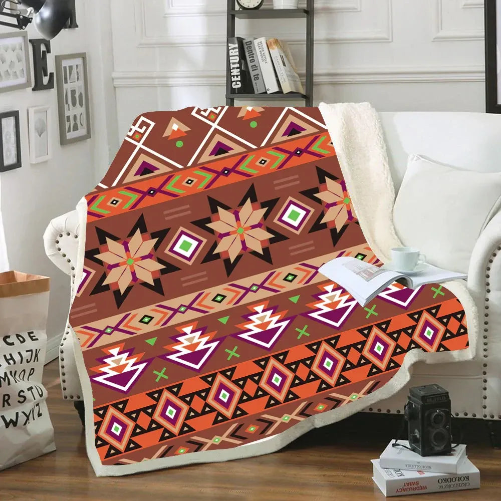 Cozy sherpa blanket with bold Native American geometric tribal patterns in warm brown, orange, and purple hues
