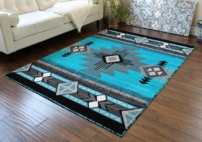 Flat-lay of a turquoise and gray Southwestern Aztec area rug showing its full central geometric medallion and border patterns.