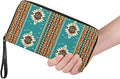 Woman holding turquoise Southwest tribal zip-around wallet to show size and fit